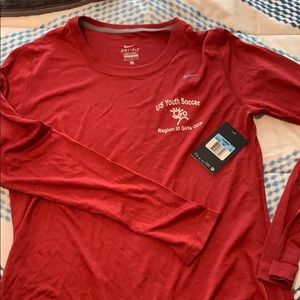 NWT Nike Woman’s long sleeve dri-fit shirt.